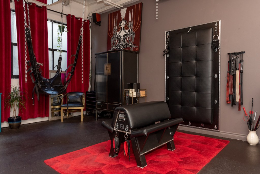 Sub Rosa's dungeon features a leather sling, cushy spanking bench, padded bondage wall, and more.